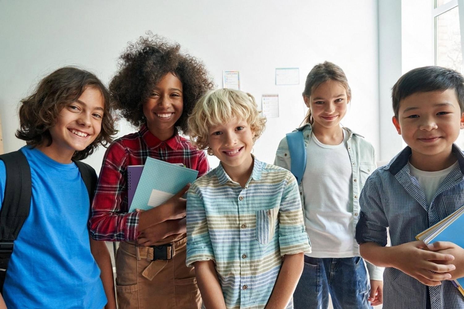 Group of middle school students smiling inside a classroom at an Indian curriculum school in the UAE